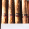 Cigar accessories including cutter, lighter, and humidor displayed together