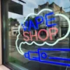 Customer browsing vape products at Rollin EZ Tobacco store